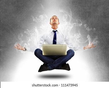 yoga businessman in total concentration with laptop