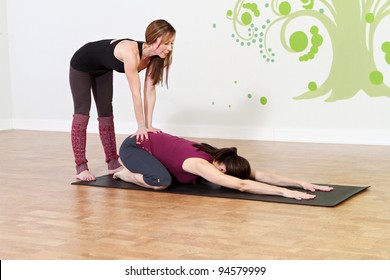 Yoga Class Instructor With Student