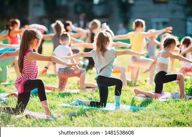 Yoga classes outside on the open air. Kids Yoga - Powered by Shutterstock