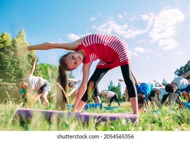 Yoga classes outside on the open air. Kids Yoga - Powered by Shutterstock