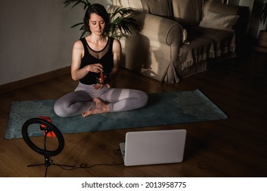 Yoga Coach Teacher Broadcasting Online Meditation Class For Webinar Class Lesson With Smartphone At Home - Focus On Girl Face