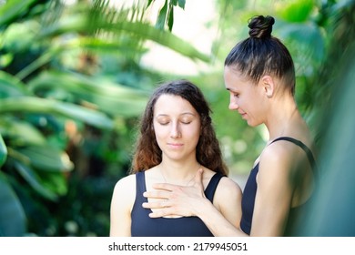 Yoga Concept, Meditation And Sound Therapy. Beautiful Young Girl At Yoga Session With Her Yoga And Meditation Teacher At Tropical Yoga Retrear