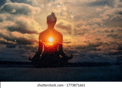 Yoga day concept. Multiple exposure image. Clouds and sun. Pranayama in lotus asana