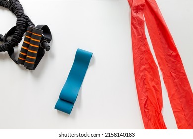 Yoga Exercise Blue Stretch Latex Rubber Band, An Orange Tension Band  A Black And Orange Exercise Cord On A White Background