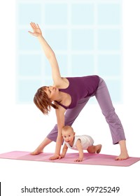 Yoga exercise / Mother with her baby practicing yoga