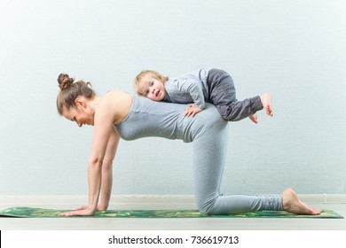 Yoga exercises mom with baby