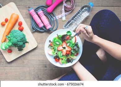 Yoga female cooking homemade salad, Healthy food