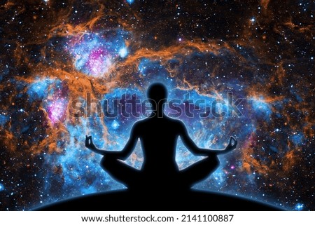 Yoga figure against  universe background with Nebula.- Elements of this image furnished by NASA