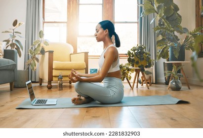 Yoga, fitness meditation and woman on laptop for online class and workout with home, holistic health and wellness. Biracial person in lotus pose, meditate and training tutorial, streaming on computer - Powered by Shutterstock