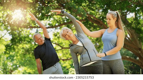 Yoga, fitness and an old couple with their coach in a park for a health or active lifestyle. Exercise, wellness or zen and senior people training outdoor for a workout with their personal trainer - Powered by Shutterstock