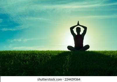 Yoga And Fitness. Silhouette Of Man Meditating