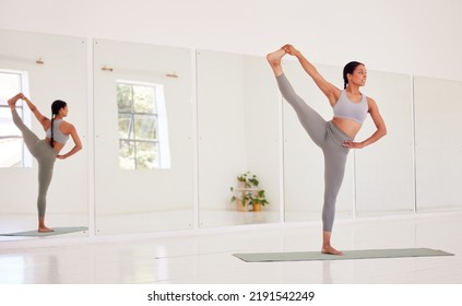 Yoga, Fitness And Wellness Woman Doing One Leg Up Pose In A Wellness Studio With Big Mirror And Copy Space. Flexible, Athletic And Fit Woman On An Exercise Mat While Exercising For Health And