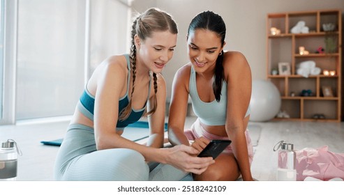 Yoga, friends and women relax with phone for social media, online message and internet. Happy, pilates and people on smartphone for exercise, training and workout for wellness, health and mobility - Powered by Shutterstock