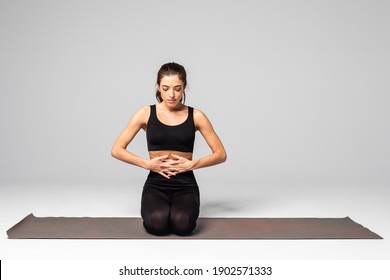 Yoga Girl Breathing In Lotus Pose With Her Hands On Her Stomach And Chest On White Background.