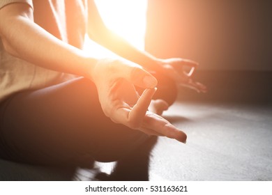 Yoga Girl Meditating Indoor And Making A Zen Symbol With Her Hand. Closeup Of Woman Body In Yoga Pose. Instagram Effect, Toned Photo