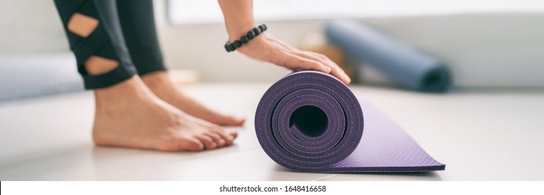 Yoga At Home Healthy Fitness Class Fit Woman Rolling Exercise Mat In Living Room For Morning Meditation Yoga Active Lifestyle Banner.