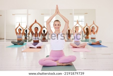Yoga instructor, group training and meditation exercise in female fitness studio. Portrait of a calm, relaxed and smiling yogi leading a peaceful training, healthy workout and mindful wellness