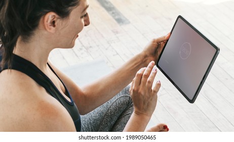 Yoga Instructor Using A Digital Tablet Mockup Mobile Phone Wallpaper