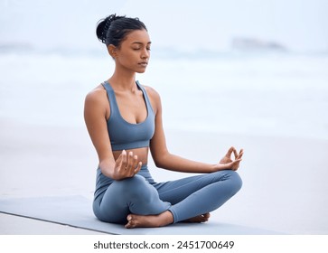 Yoga, lotus meditation and Indian girl at beach for mindfulness, peace or relax on mockup space. Zen, ocean and woman in padmasana pose for exercise, fitness and wellness for body healthy outdoor - Powered by Shutterstock