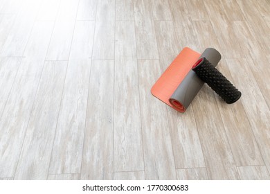 Yoga Mat And Foam Roller On Floor In Living Room For Meditation Yoga