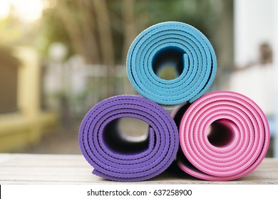 Yoga Mat On The Wooden Table