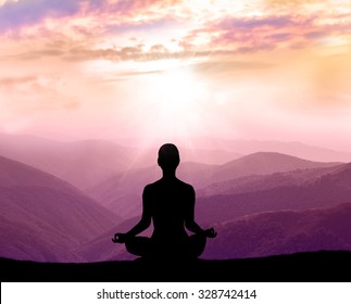  Yoga And Meditation. Silhouette Of Man In The Mountain