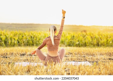 Yoga Meditation Wellness Woman Meditating On Morning Sunrise Nature Background In Peace And Zen Positive Attitude Panoramic Banner. Active Sport And Fitness Lifestyle Image.