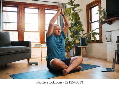 Yoga, Meditation And Wellness With A Zen Man Following An Online Class For Fitness, Exercise And Workout At Home. Senior, Retirement And Health With An Elderly Male Pensioner Exercising In His House