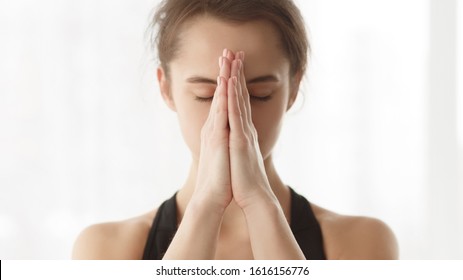 Yoga For Mind. Woman Holding Hands In Namaste Or Prayer, Practising Yoga And Meditating