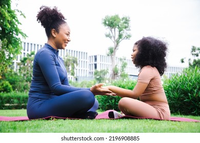 Yoga outdoor in the park. Young woman relax after doing yoga exercise outdoor at the day time with fresh air in the garden. Sport and exercise concept - Powered by Shutterstock