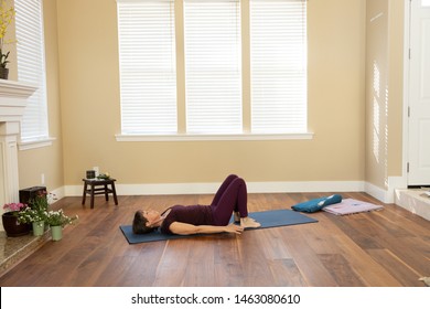 Yoga pose back on floor knees bent