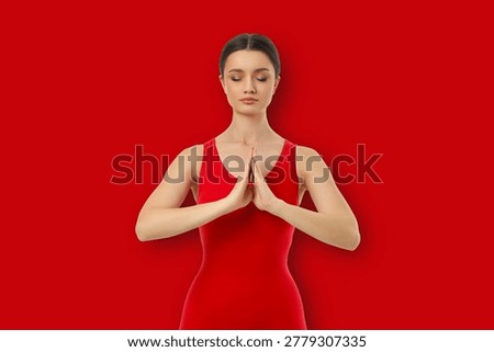 Yoga practitioner performs poses with hands together in front