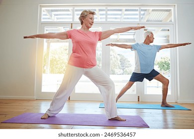 Yoga, stretching and senior couple in home for fitness, health and wellness with warrior pose. Workout, mature man and woman on mat for pilates, balance and body care exercise together in retirement. - Powered by Shutterstock