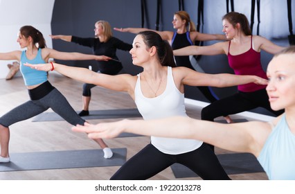 Yoga in studio, group of females practicing healthy lifestyle