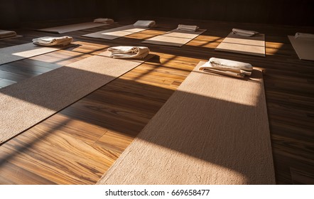 Yoga studio interior with carpets and towels