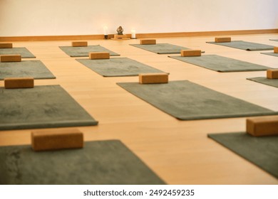 A yoga studio with a lot of mats and blocks. No people. - Powered by Shutterstock