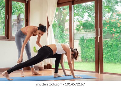 Yoga Training. Fitness Lady Beginning Yoga Practice With Yoga Trainer At Home.