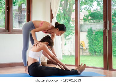 Yoga Training. Fitness Lady Beginning Yoga Practice With Yoga Trainer At Home.