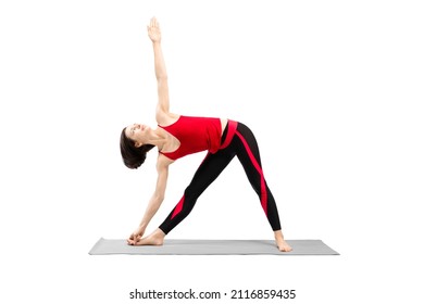 Yoga, triangle pose. Attractive fit woman in red sportswear with haircut practice Utthita Trikonasana drill, isolated on white.