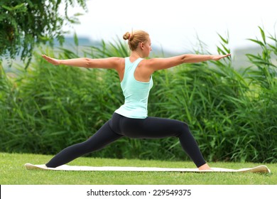 Yoga Virabhadrasana II Warrior Pose By Woman