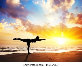 Yoga Virabhadrasana III, Warrior Pose By Woman In Silhouette With Sunset Sky Background. Free Space For Text