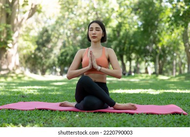 Yoga Woman Meditation Praying Outside In City Park Wellness. Summer Exercise Lifestyle Active Young Asian Girl Meditating Background.