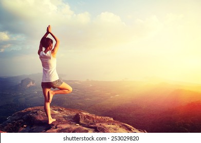 yoga woman mountain peak - Powered by Shutterstock