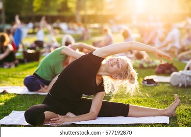 Yoga Woman On Green Grass.