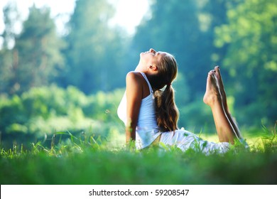 yoga woman on green park - Powered by Shutterstock