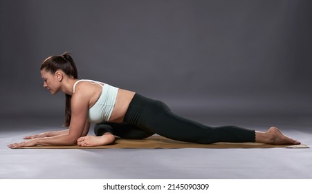 Yoga Woman In Sleeping Pigeon Pose (Eka Pada Rajakapotasana)