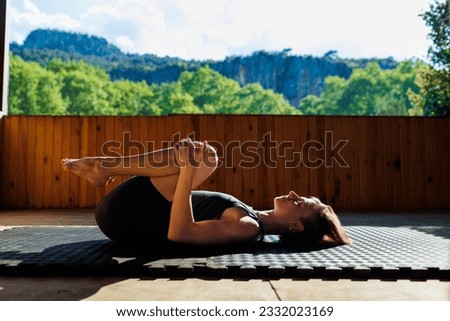 yoga woman. young girl is doing yoga. does yoga. girl doing exercise in yoga class. Active lifestyle.