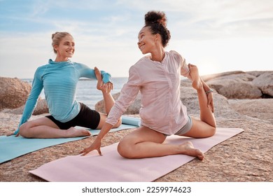 Yoga, women or stretching on beach mat in ocean workout, relax sea training or bonding exercise. Smile, happy or friends in nature pilates, fitness flexibility or healthcare wellness routine on rock - Powered by Shutterstock