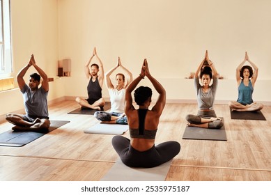 Yoga, workout and people in studio for class for wellness, meditation and mindfulness. Personal trainer, pilates and men and women for exercise, training and stretching for calm, balance and health - Powered by Shutterstock