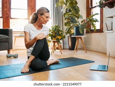 Yoga, Zen And Senior Woman On Laptop Streaming Training Video, Web Yoga Class Or Tutorial At Home. Health, Exercise And Elderly Female On Tech Pc, Pilates Mat And Stretching, Fitness And Wellness.